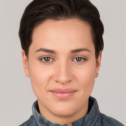 Joyful white young-adult female with short  brown hair and brown eyes