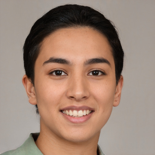 Joyful white young-adult female with short  brown hair and brown eyes