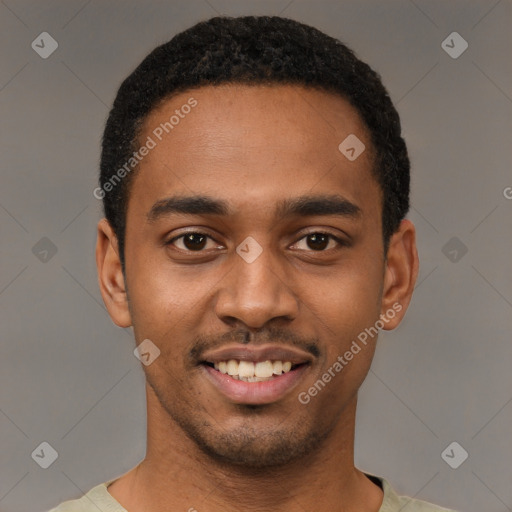 Joyful black young-adult male with short  black hair and brown eyes