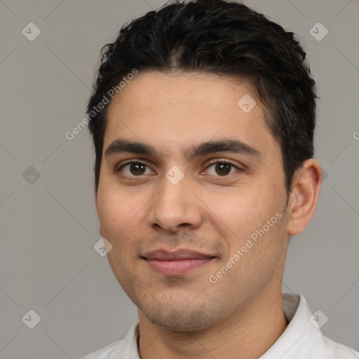 Joyful white young-adult male with short  black hair and brown eyes