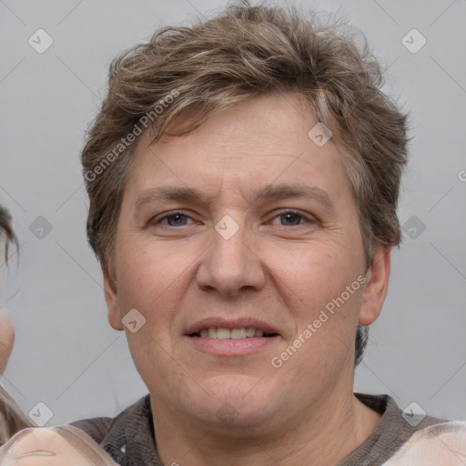 Joyful white adult male with short  brown hair and grey eyes