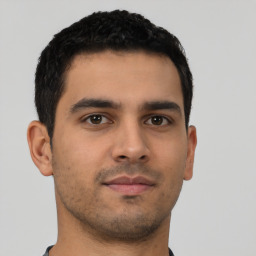 Neutral latino young-adult male with short  brown hair and brown eyes