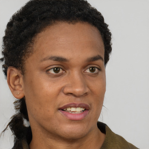 Joyful black young-adult female with short  brown hair and brown eyes