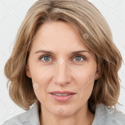 Joyful white young-adult female with medium  brown hair and blue eyes