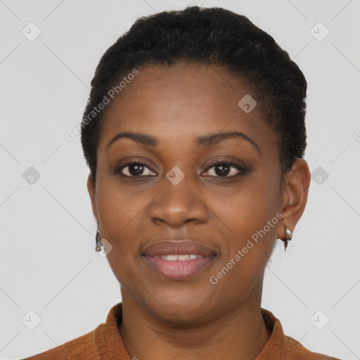 Joyful black young-adult female with short  black hair and brown eyes