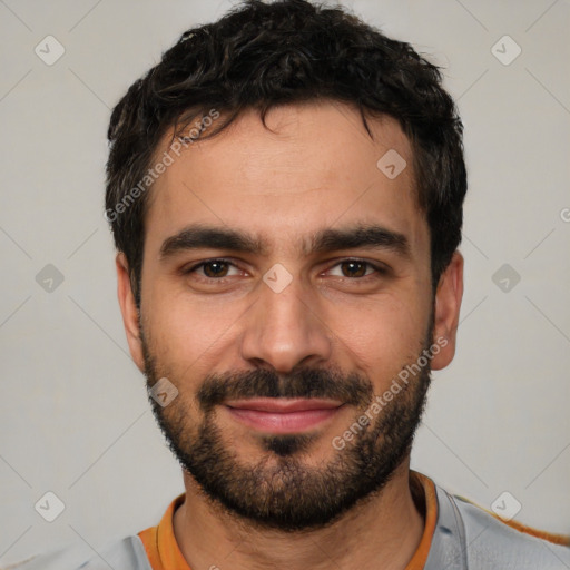 Joyful white young-adult male with short  black hair and brown eyes