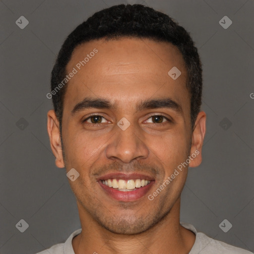 Joyful latino young-adult male with short  brown hair and brown eyes