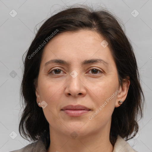 Joyful white adult female with medium  brown hair and brown eyes