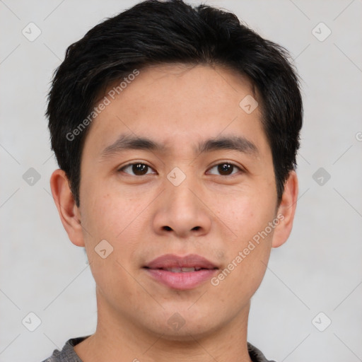 Joyful white young-adult male with short  black hair and brown eyes