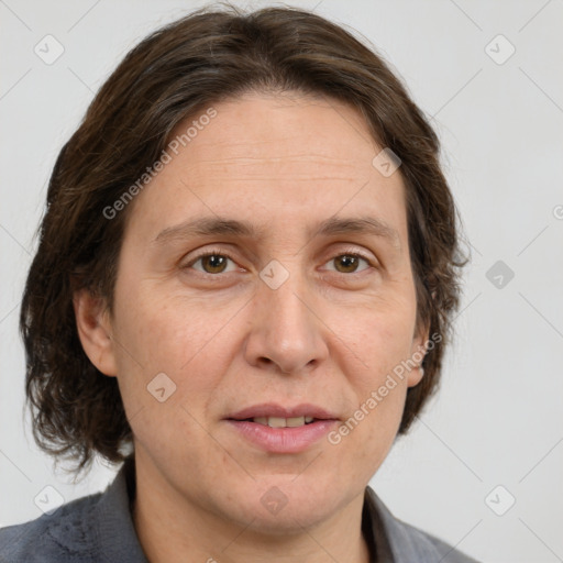 Joyful white adult female with medium  brown hair and grey eyes