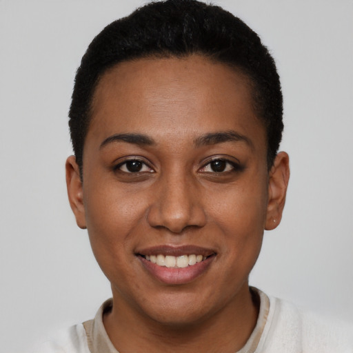 Joyful latino young-adult female with short  black hair and brown eyes