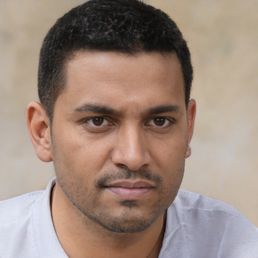 Neutral latino young-adult male with short  brown hair and brown eyes