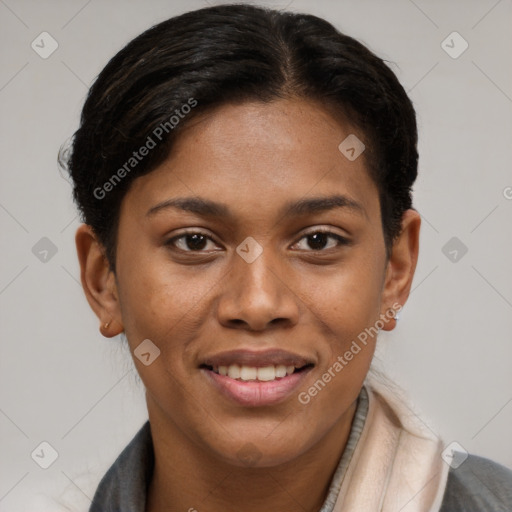 Joyful black young-adult female with short  brown hair and brown eyes