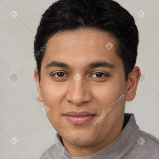 Joyful latino young-adult male with short  black hair and brown eyes