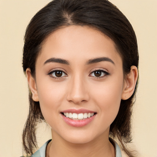 Joyful white young-adult female with long  brown hair and brown eyes