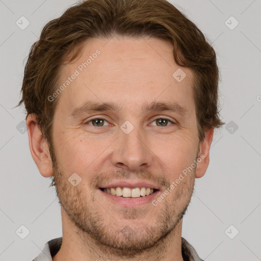 Joyful white adult male with short  brown hair and grey eyes