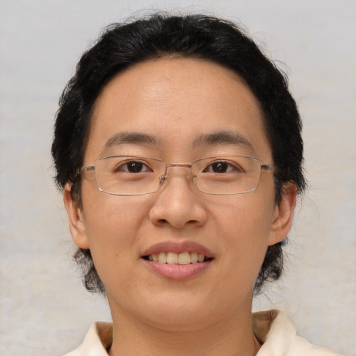 Joyful white adult female with short  brown hair and brown eyes