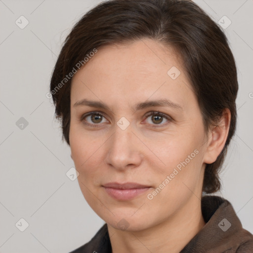 Joyful white adult female with short  brown hair and brown eyes