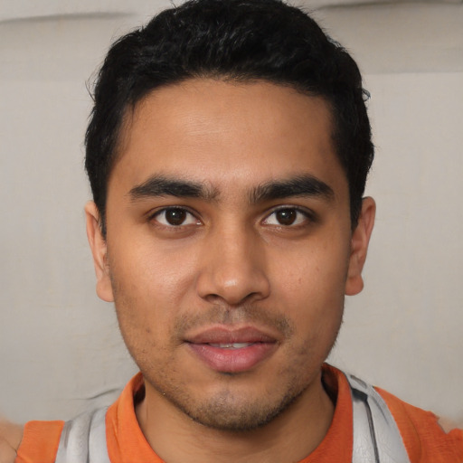 Neutral latino young-adult male with short  brown hair and brown eyes