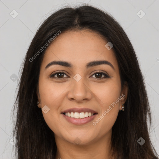 Joyful latino young-adult female with long  brown hair and brown eyes