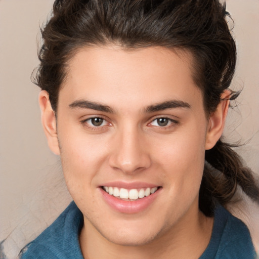 Joyful white young-adult male with medium  brown hair and brown eyes