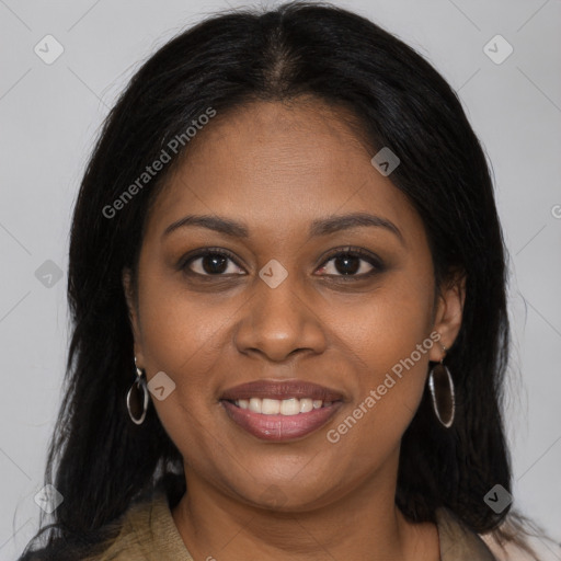 Joyful black young-adult female with long  brown hair and brown eyes