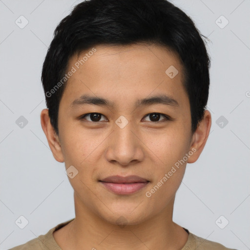 Joyful asian young-adult male with short  black hair and brown eyes