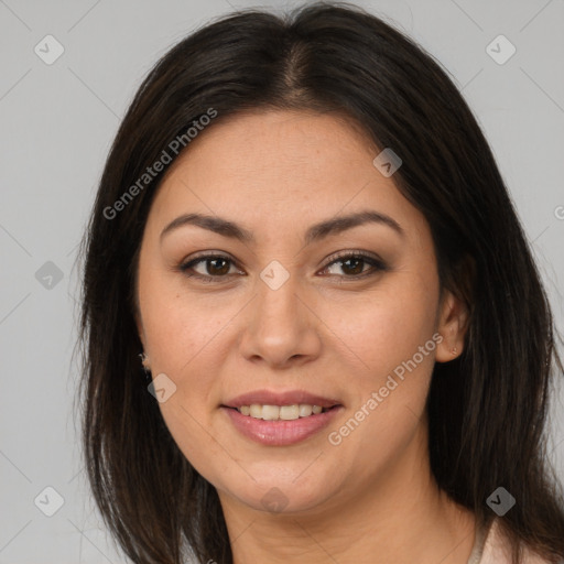 Joyful latino young-adult female with medium  brown hair and brown eyes