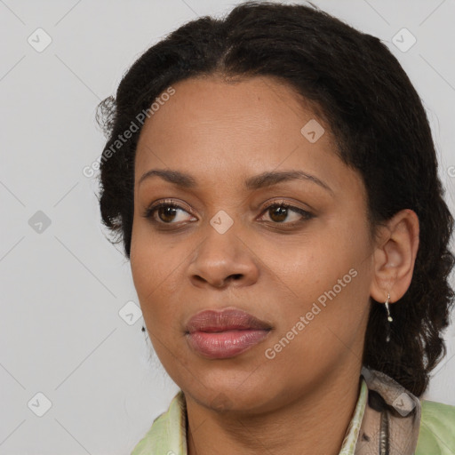 Joyful black young-adult female with medium  brown hair and brown eyes