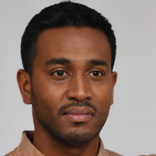 Neutral black young-adult male with short  black hair and brown eyes