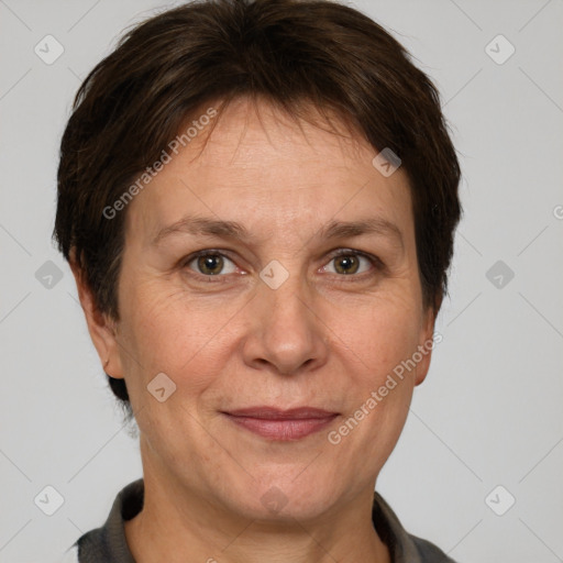 Joyful white adult female with short  brown hair and grey eyes