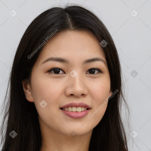 Joyful asian young-adult female with long  brown hair and brown eyes