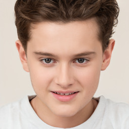 Joyful white child male with short  brown hair and brown eyes