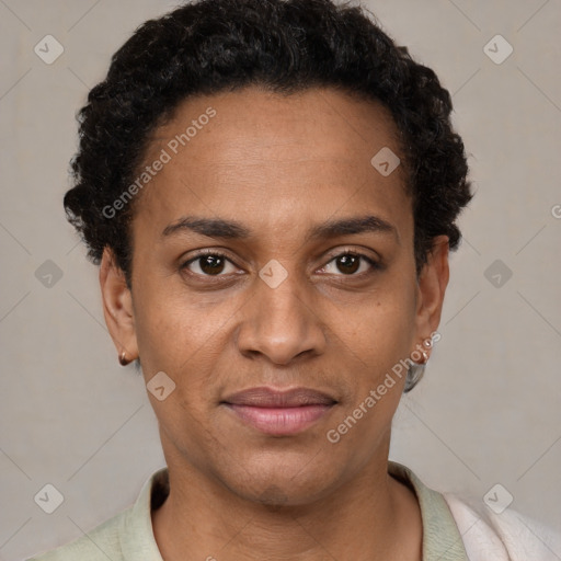 Joyful black adult female with short  brown hair and brown eyes