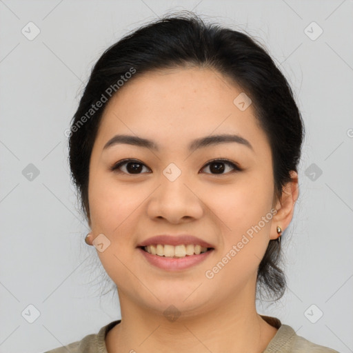 Joyful asian young-adult female with medium  black hair and brown eyes