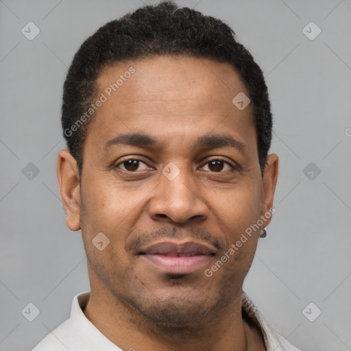 Joyful latino young-adult male with short  brown hair and brown eyes