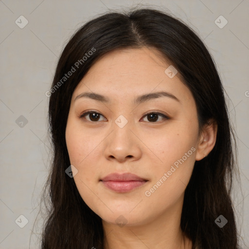 Joyful asian young-adult female with long  brown hair and brown eyes