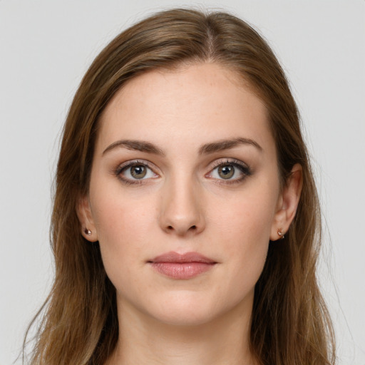 Neutral white young-adult female with long  brown hair and green eyes