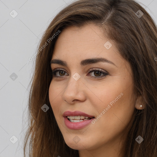 Joyful white young-adult female with long  brown hair and brown eyes