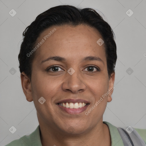 Joyful latino adult female with short  brown hair and brown eyes