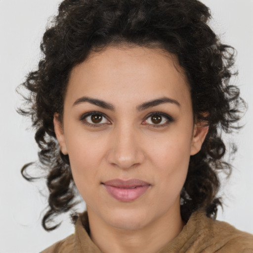 Joyful latino young-adult female with medium  brown hair and brown eyes