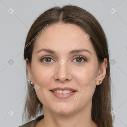 Joyful white young-adult female with long  brown hair and grey eyes