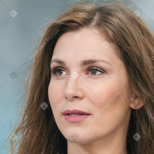 Joyful white adult female with long  brown hair and brown eyes