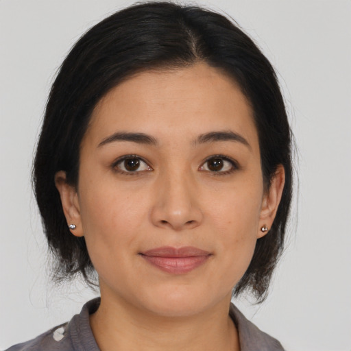 Joyful asian young-adult female with medium  brown hair and brown eyes