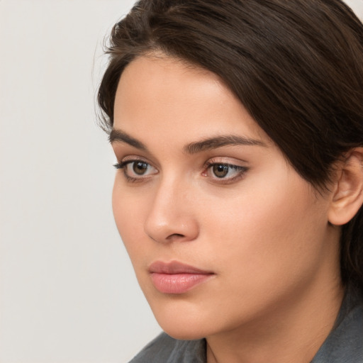 Neutral white young-adult female with medium  brown hair and brown eyes