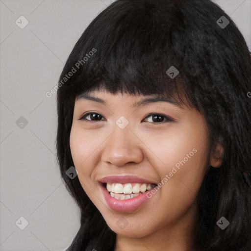Joyful white young-adult female with long  black hair and brown eyes