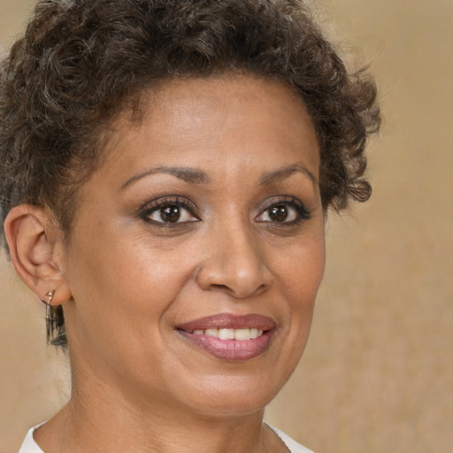 Joyful white adult female with short  brown hair and brown eyes