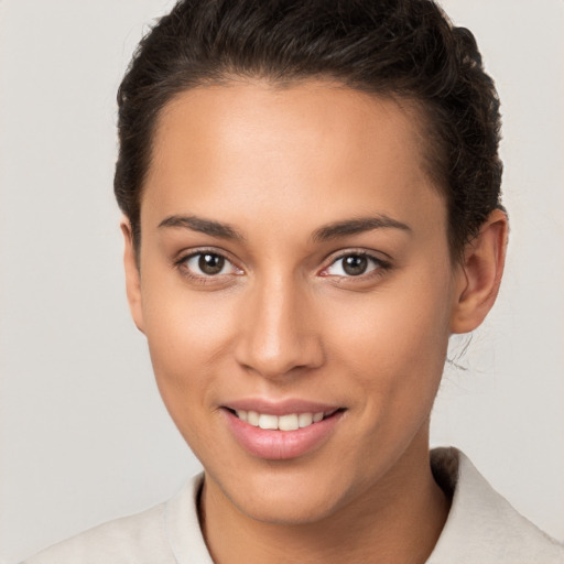 Joyful white young-adult female with short  brown hair and brown eyes