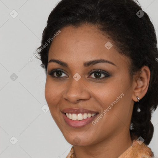 Joyful latino young-adult female with medium  brown hair and brown eyes