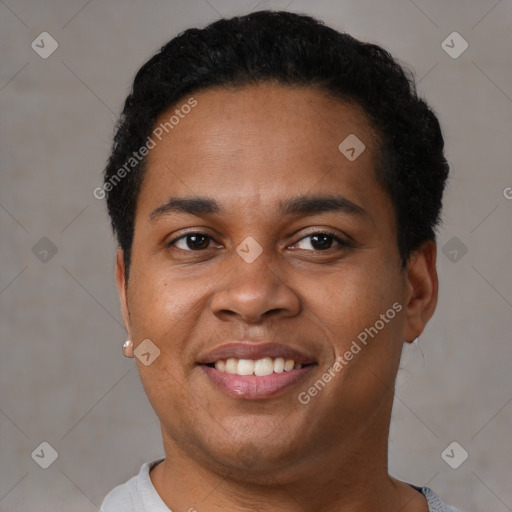 Joyful black young-adult male with short  brown hair and brown eyes